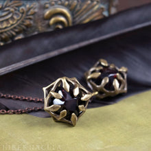 Load image into Gallery viewer, Unbound  -- Garnet Dodecahedron Caged in Bronze | Hibernacula