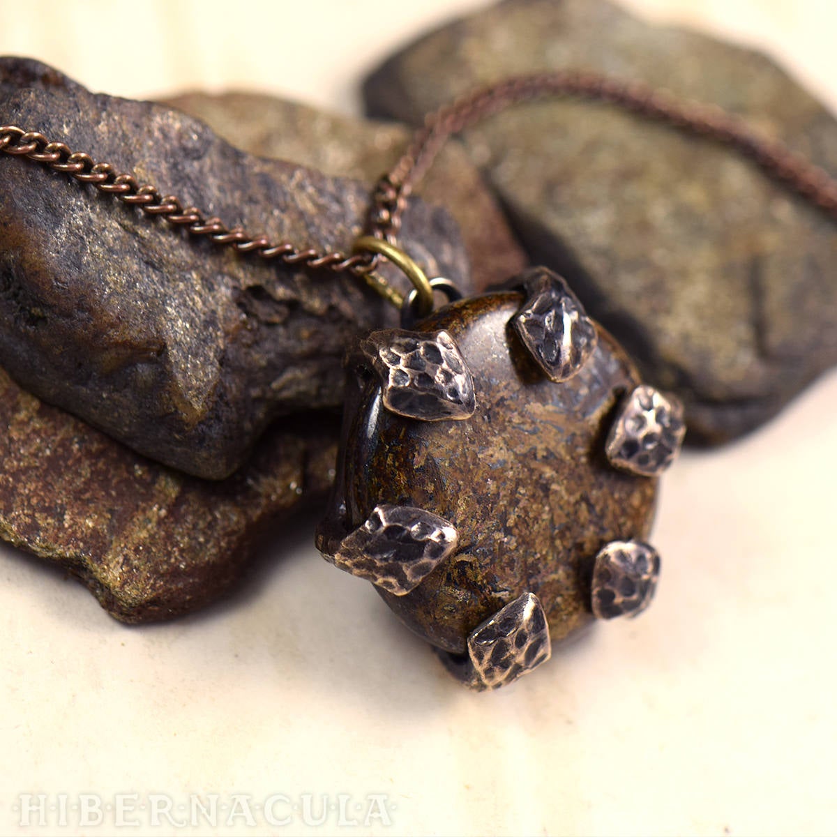 Dragon Stone shops – Bronzite disc set in Bronze